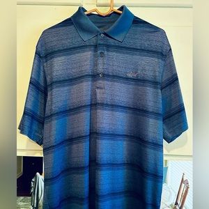 Gold polo shirt. Greg Norman
